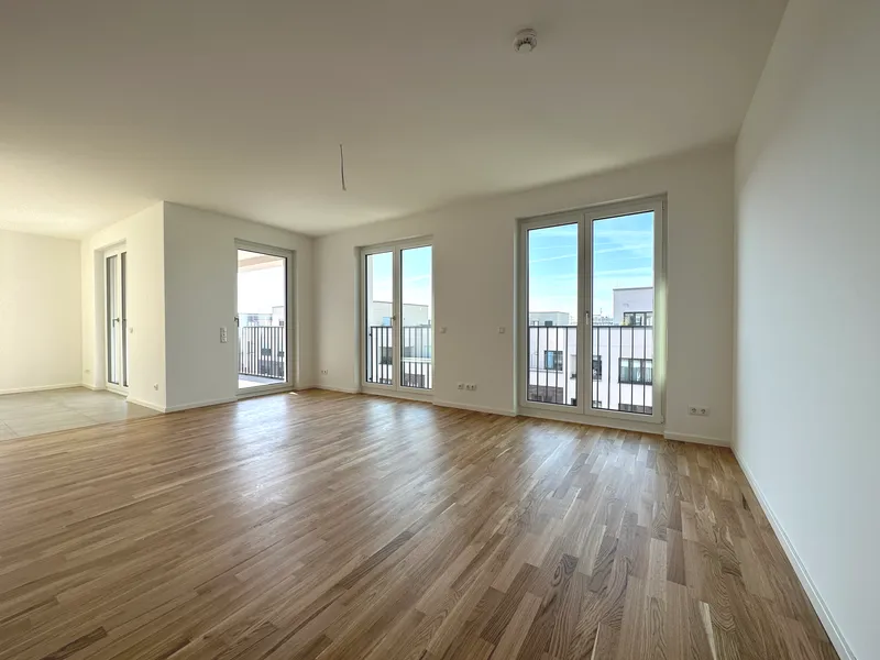 Moderne Neubauwohnung mit drei Zimmern, Balkon und Einbauküche, Erstbezug — photo 1